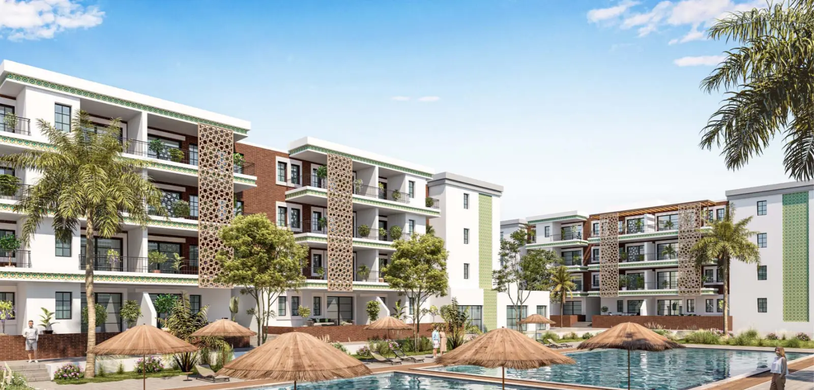 Impressie van een zwembad met strooien parasols en ligbedden tussen de appartementengebouwen